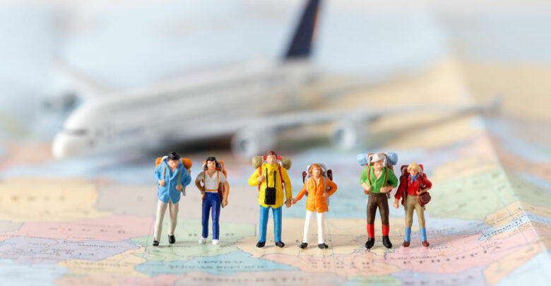 Miniature Model Team Traveller Model Standing Together On Map, P